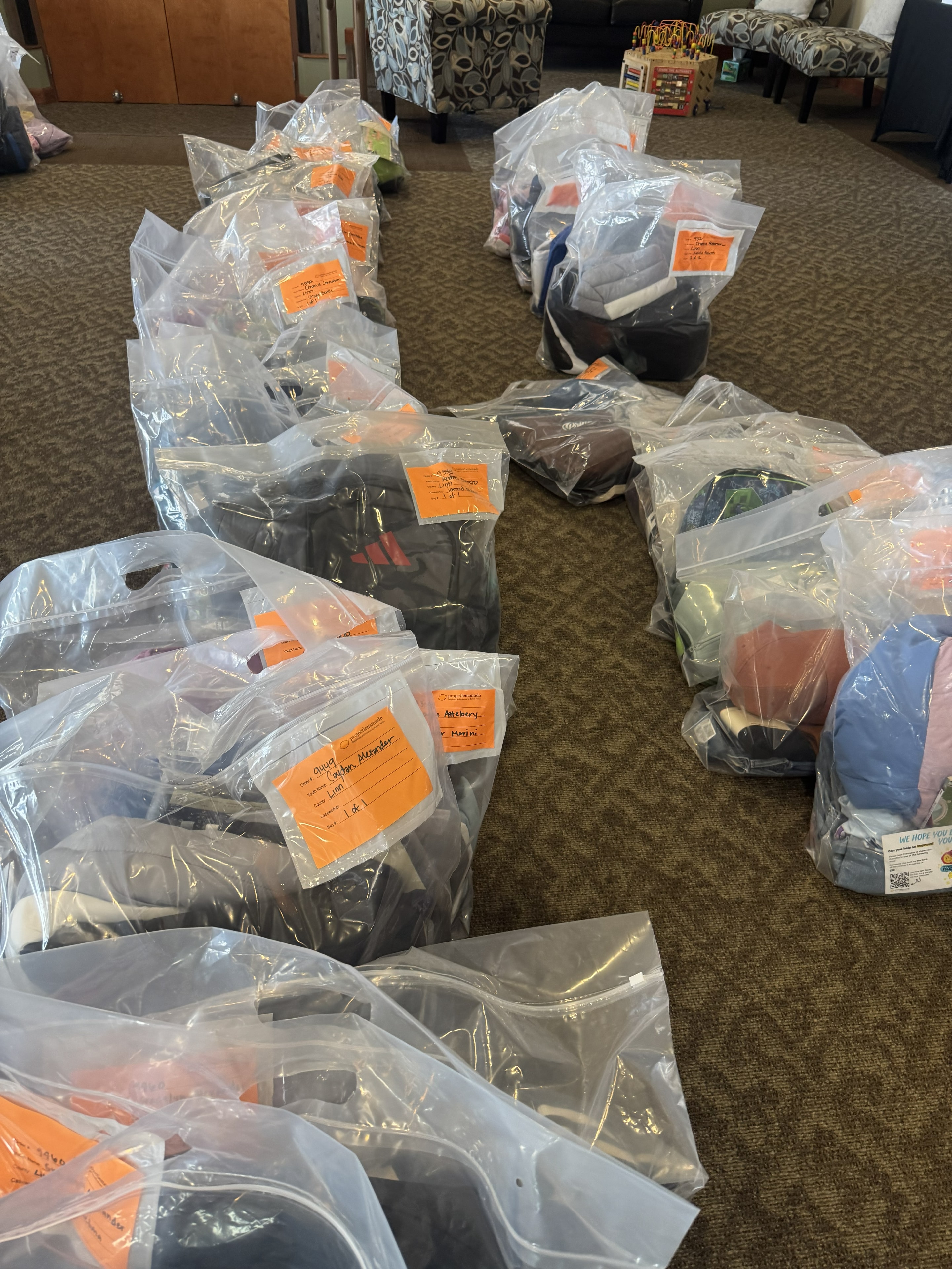 Labeled clothing bags ready for distribution