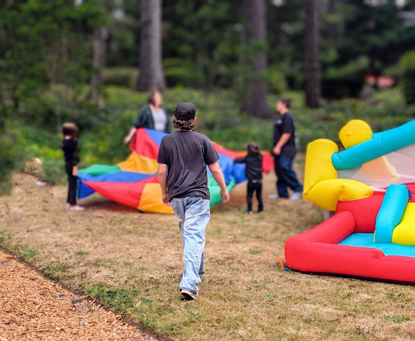 Kids playing with a parachute outdoors